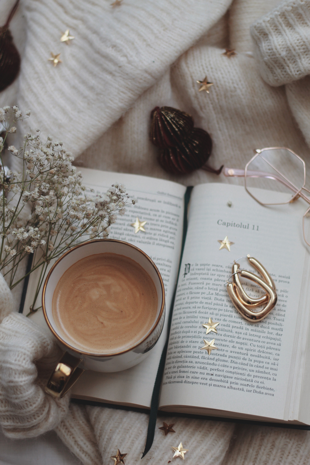 White Ceramic Mug on the Book